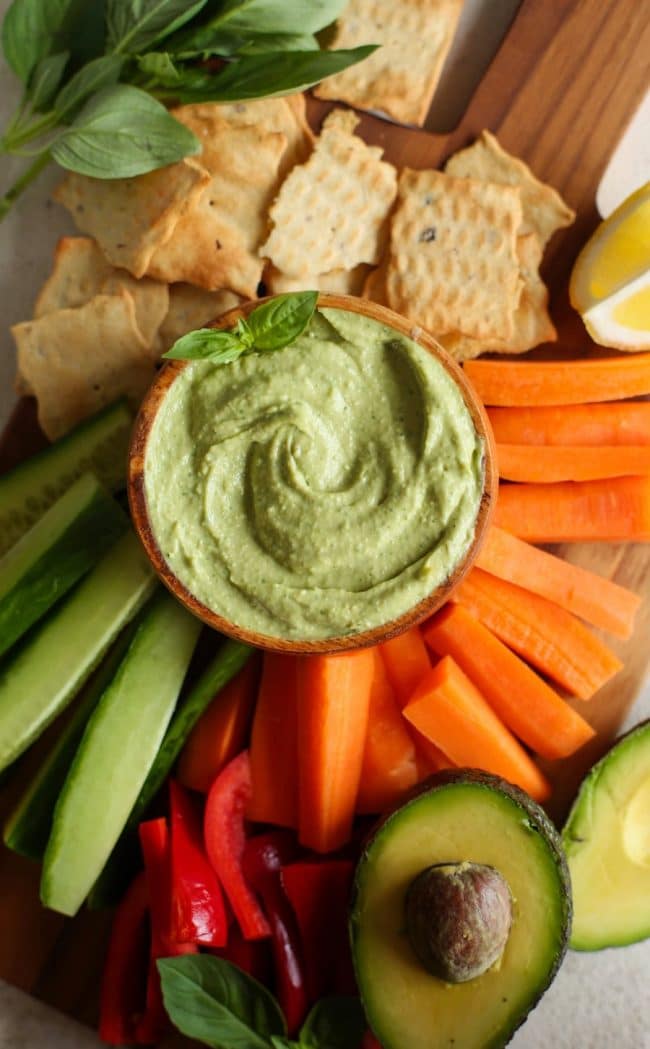 Creamy Basil Avocado Dip on a veggie platter