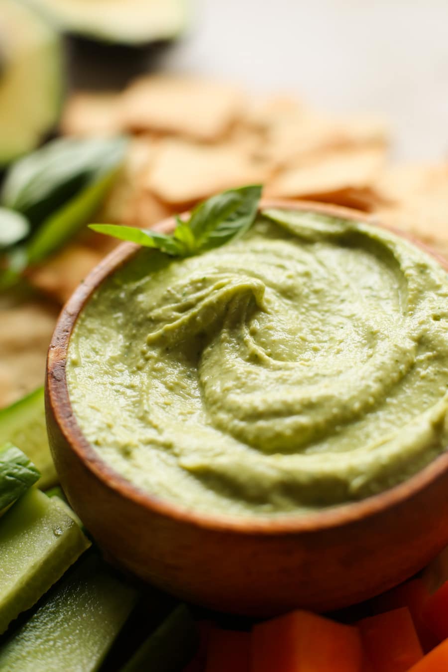 Creamy Basil Avocado Dip made with avocado, lemon juice, garlic, tahini, sea salt & fresh basil. | Gluten Free + Vegan + Paleo