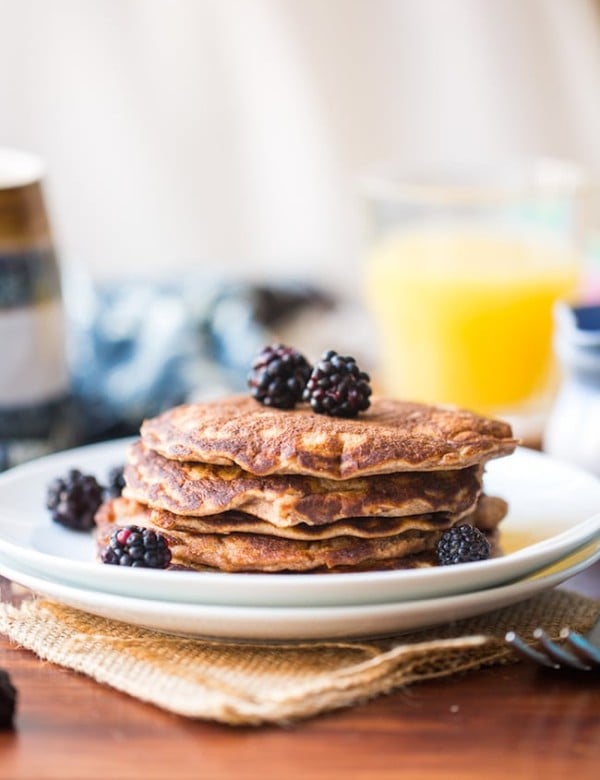 Coconut Flour Pancakes in a plate topped with blackberries