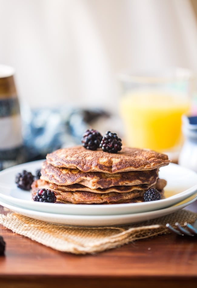 Coconut Flour Pancakes in a plate topped with blackberries