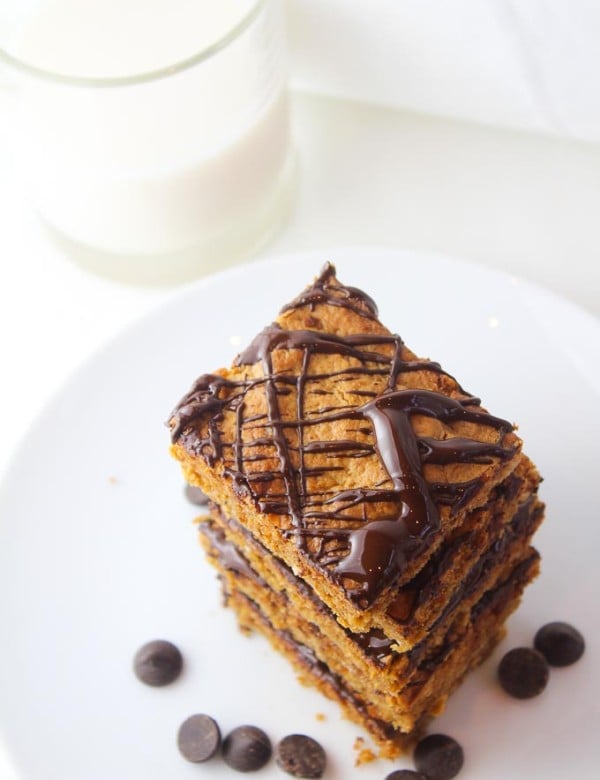 peanut butter oatmeal bars with chocolate drizzled over the top