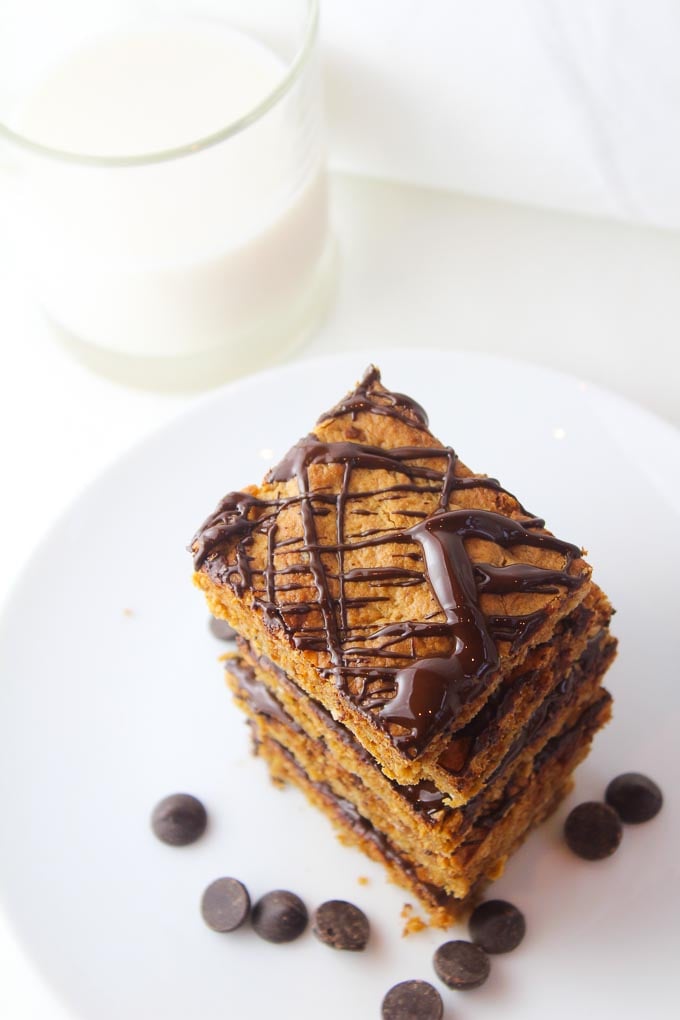 peanut butter oatmeal bars with chocolate drizzled over the top