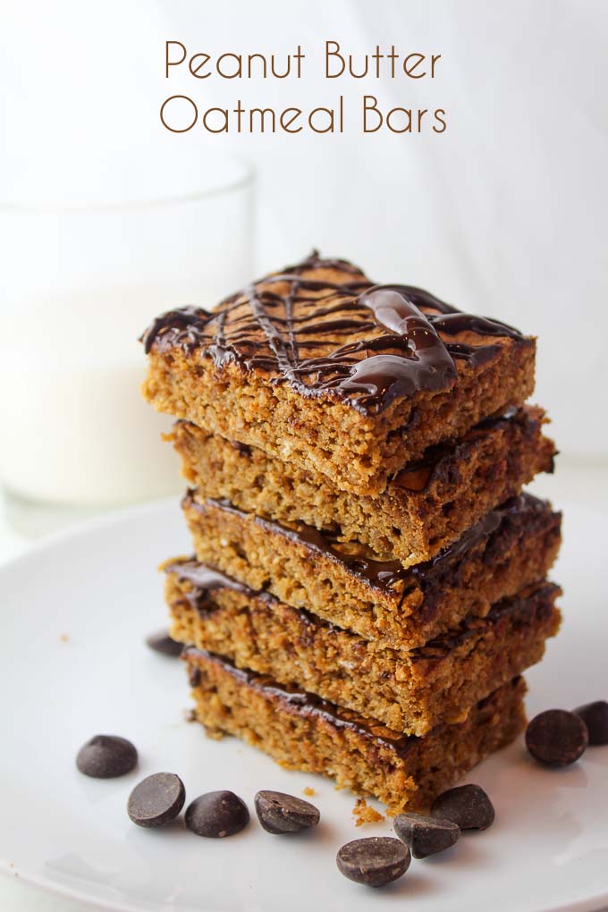 a stack of four Peanut Butter Oat Bars surrounded by chocolate chips with the title 