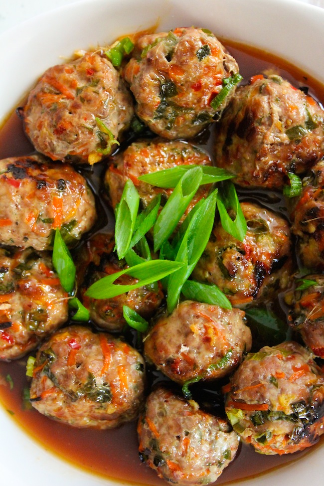 Thai Meatballs topped with spring onions in a chili sauce 