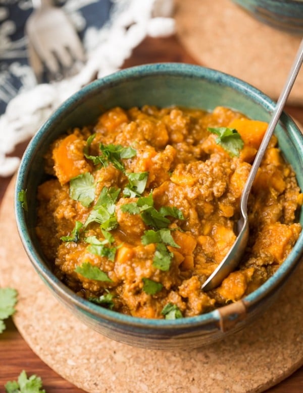 Paleo Chili Sweet Potato in a bowl with a spoon stick out