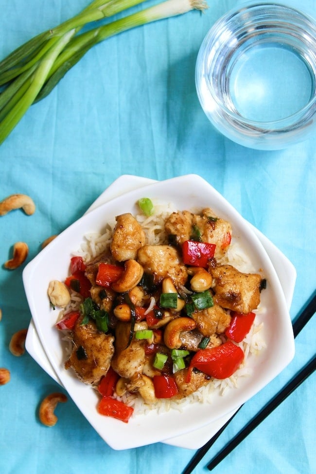 Whole 30 Cashew Chicken in a bowl topped with green onions