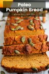 paleo pumpkin bread sliced and topped with pepitas with recipe name