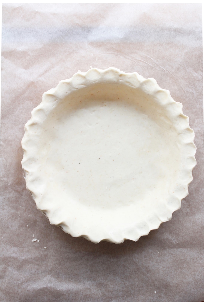 unbaked pie crust in a baking pan