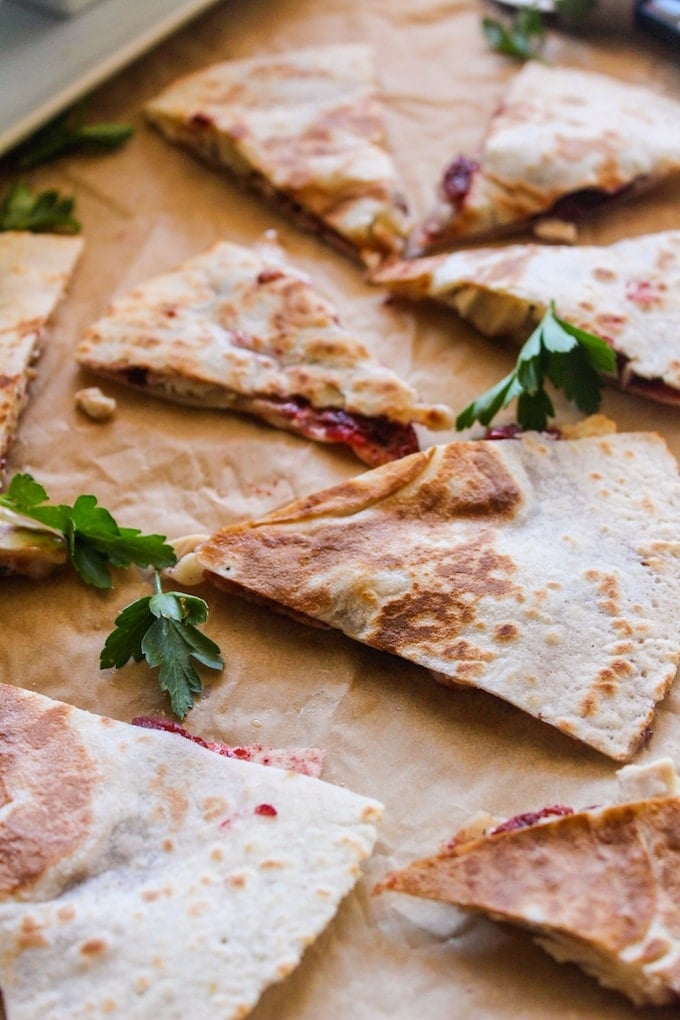 Turkey, cranberry, and brie quesadilla  on baking paper