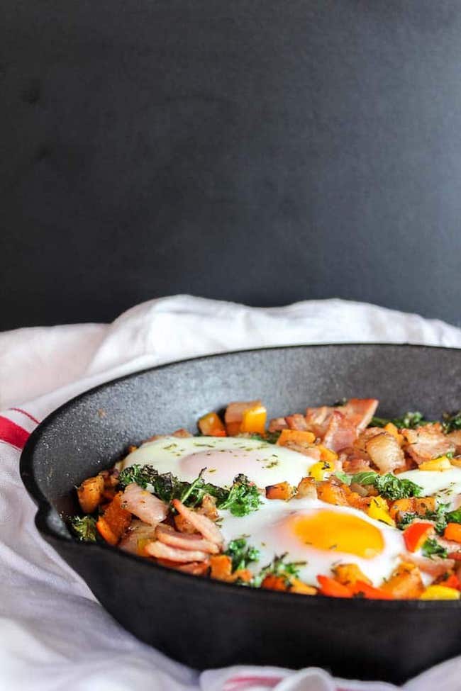 Bacon Kale & Sweet Potato Hash in a cast iron skillet