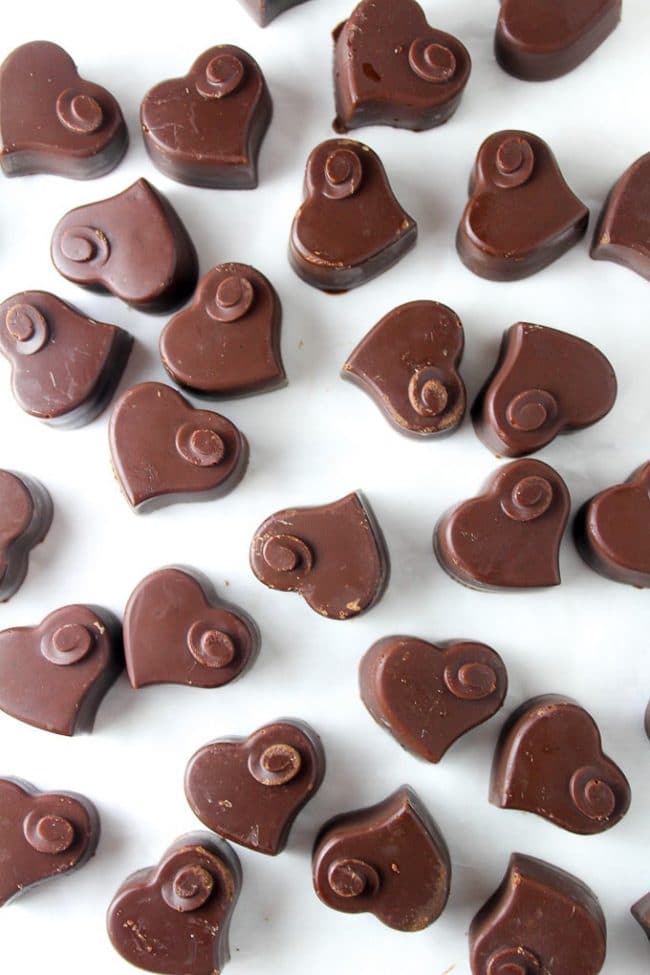 Homemade Dark Chocolate hearts on a white table