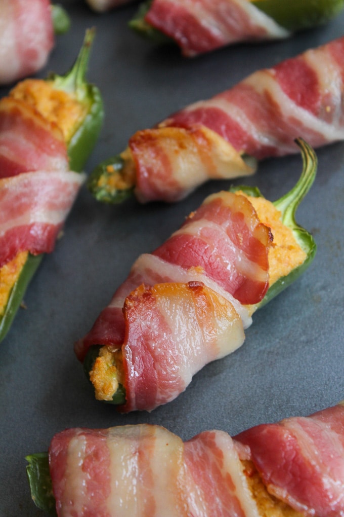 Paleo Jalapeño Poppers wrapped in bacon slices and stuffed with a dairy free cashew cream