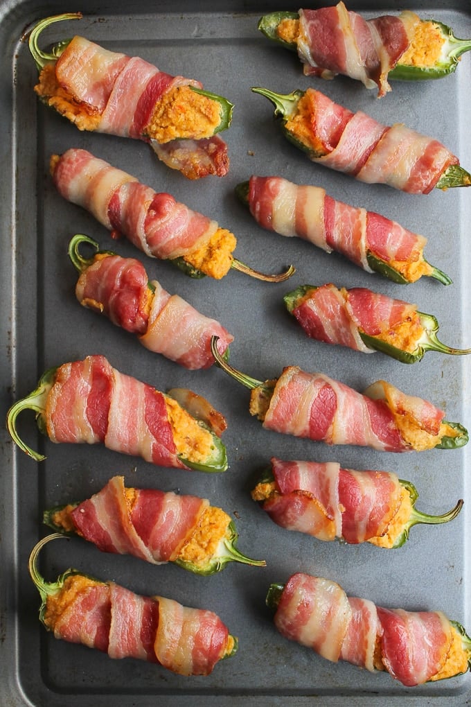 Paleo Jalapeño Poppers stuffed with a dairy free cashew cream on a baking sheet