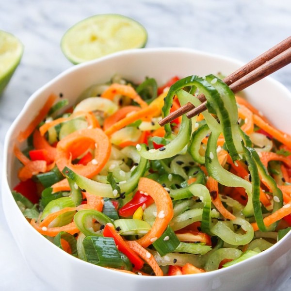 Asian Cucumber Sesame Salad in a bowl with chopsticks