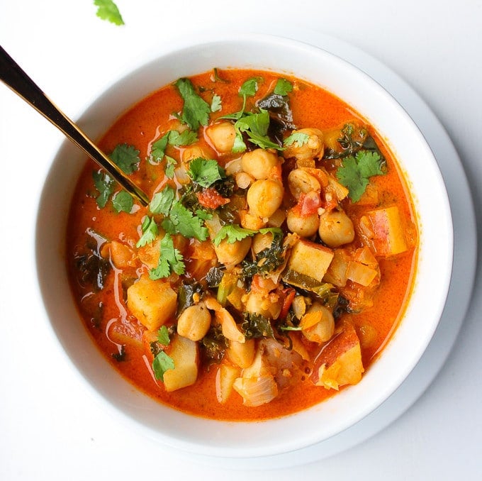 Tomato Coconut Curry Stew | Loaded with chickpeas, kale, potatoes and topped with a sprinkling of fresh coriander | Gluten Free & Vegan