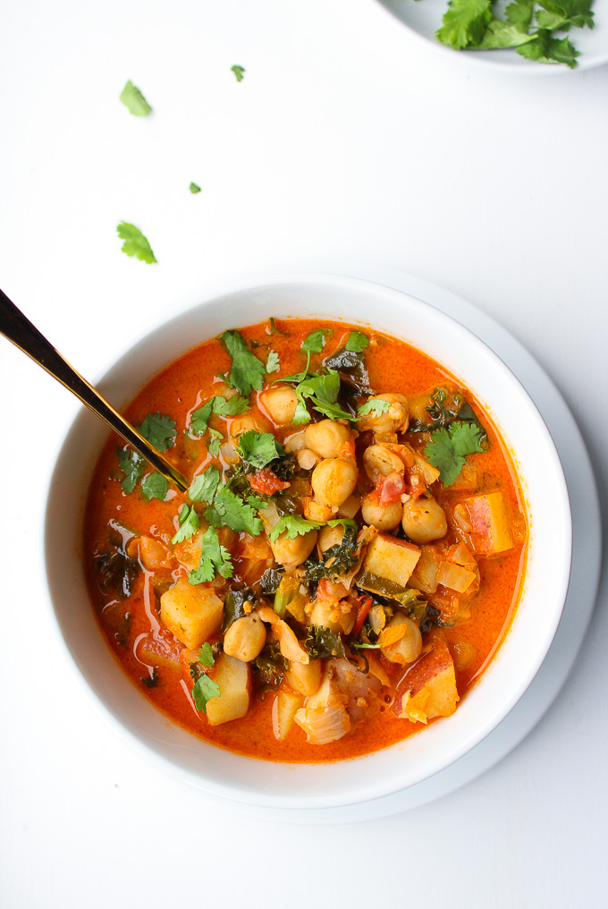 Tomato Coconut Curry Stew | Loaded with chickpeas, kale, potatoes and topped with a sprinkling of fresh coriander | Gluten Free & Vegan