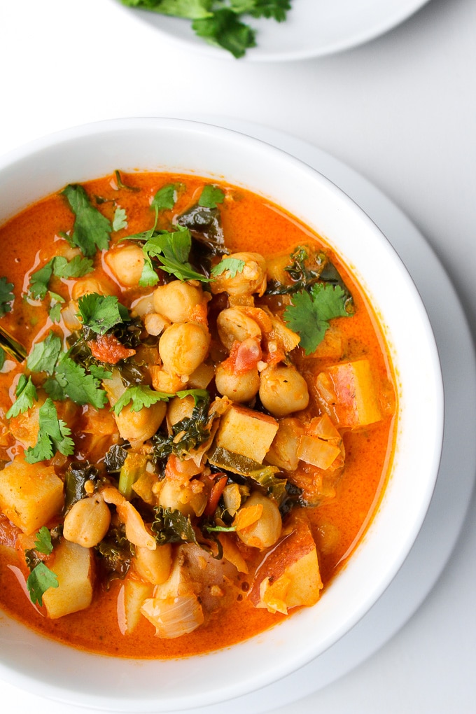 Tomato Coconut Curry Stew | Loaded with chickpeas, kale, potatoes and topped with a sprinkling of fresh coriander | Gluten Free & Vegan