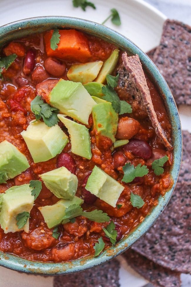 Chunky Vegetarian Chili topped with avocado chunks