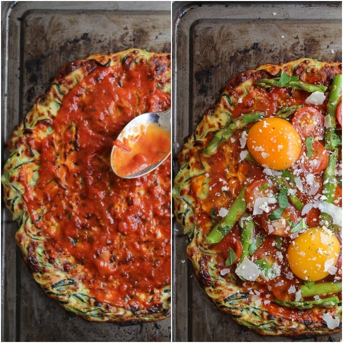 Zucchini Crusted Breakfast Pizza topped with sliced asparagus, cherry tomatoes, eggs, and a sprinkling of parmesan cheese.