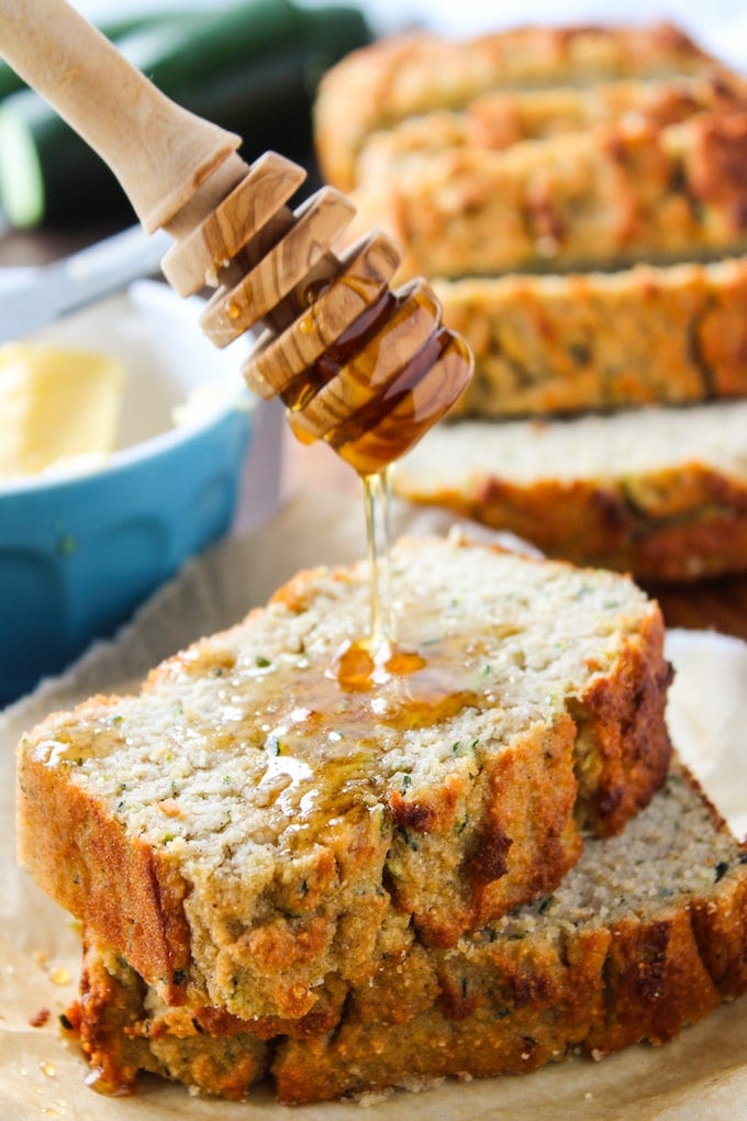 Paleo Zucchini Bread with honey drizzling over the top