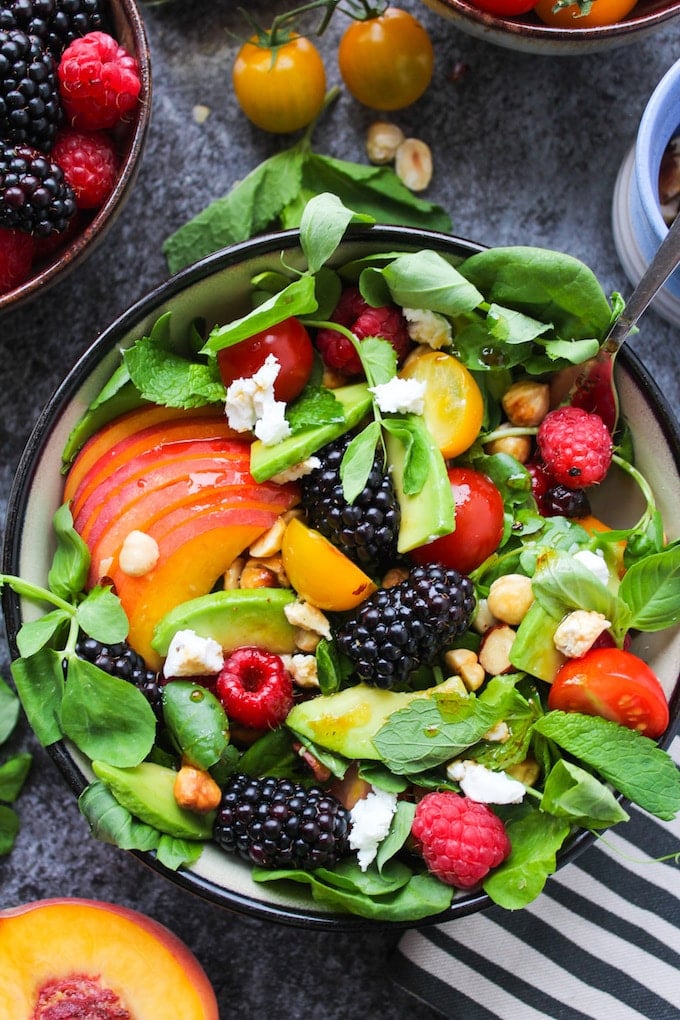 Bright and tangy fruit and nut summer salad with blackberries, raspberries, cherry tomatoes, avocado and toasted hazelnuts - all dressed in a simple balsamic vinaigrette | Paleo, Grain Free, Low Carb