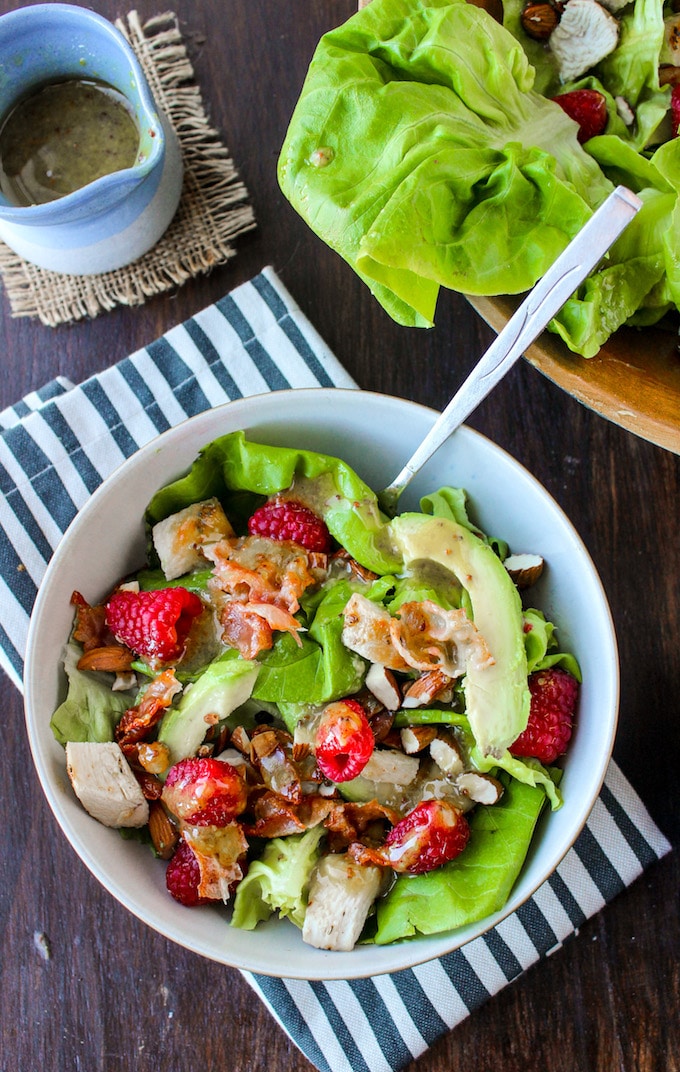 Chopped chicken & raspberry salad with sliced avocado, crispy pancetta, and a handful of almonds topped with a creamy maple mustard dressing | paleo + dairy free + low fodmap