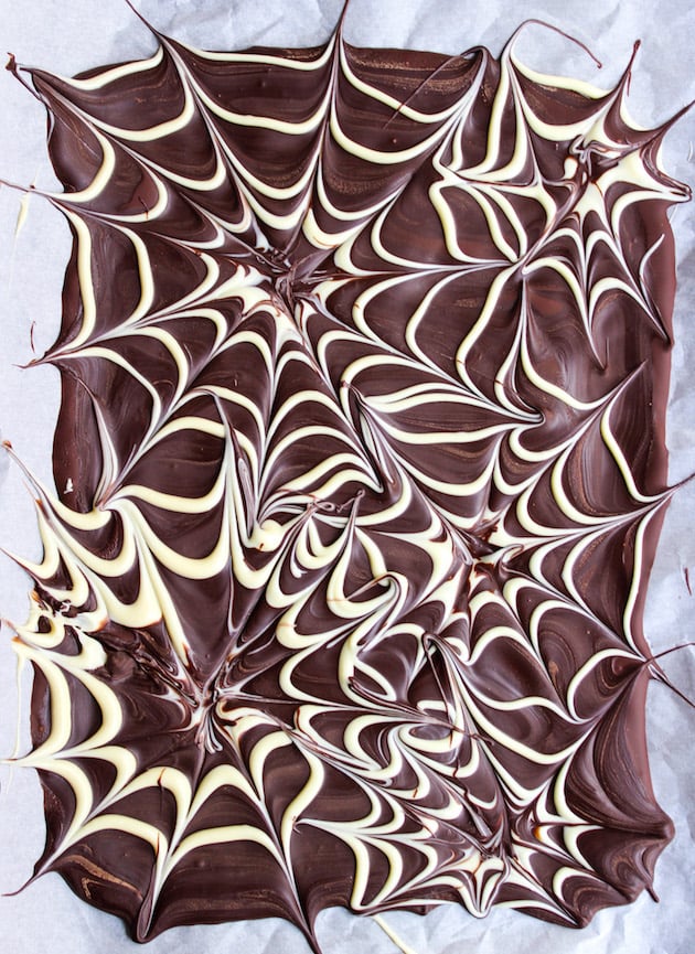 Spider web chocolate bark on a baking sheet