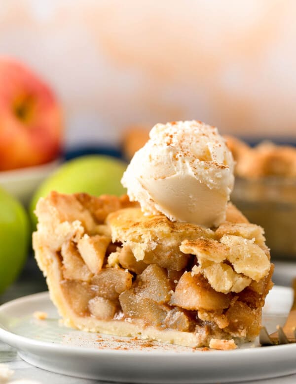 a slice of paleo apple with a scoop of vanilla ice cream on top