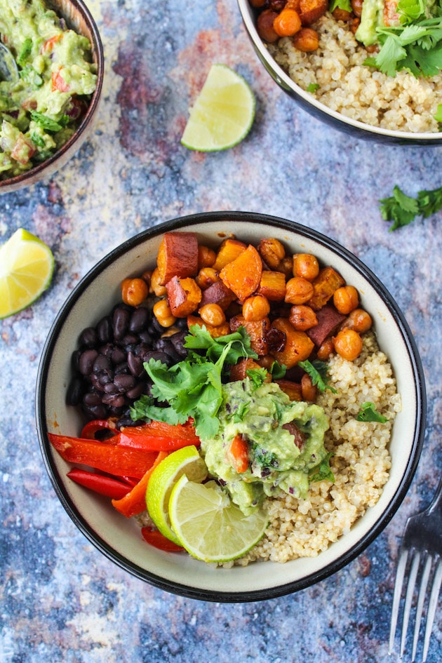 Spicy Chipotle Chickpea Burrito Bowls with roasted sweet potatoes, peppers, black beans and guacamole over a bed of quinoa | vegan + gluten free