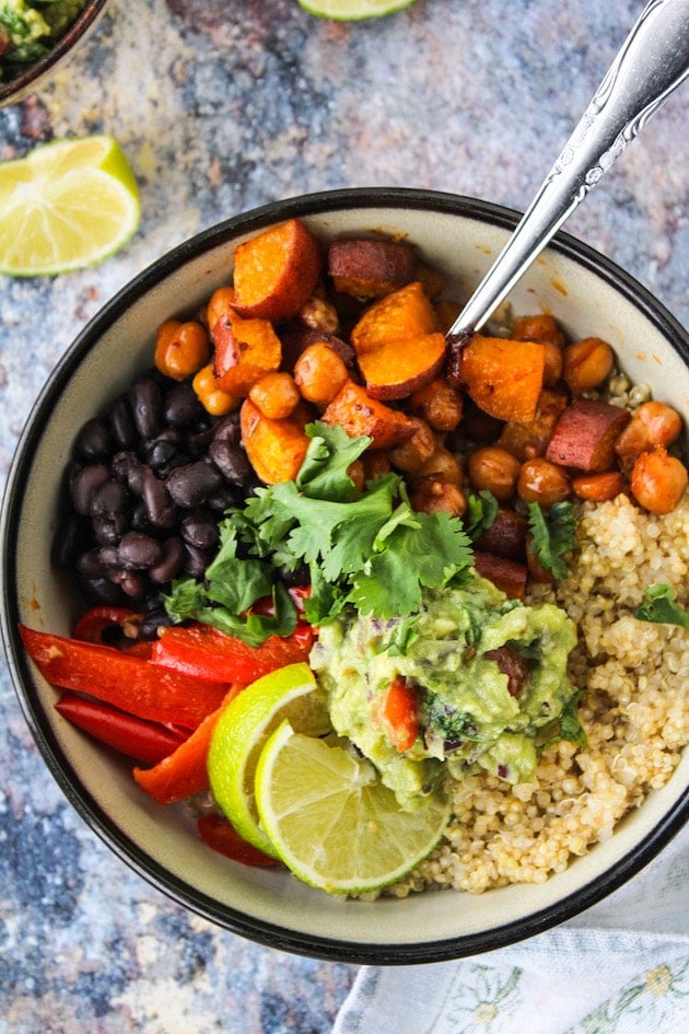 Spicy Chipotle Chickpea Burrito Bowls with roasted sweet potatoes, peppers, black beans and guacamole over a bed of quinoa | vegan + gluten free