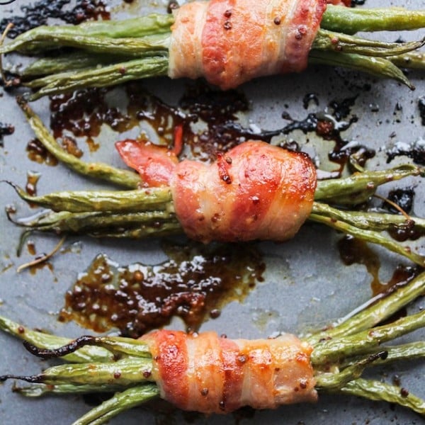 Honey Mustard Bacon Wrapped Green Beens on a baking sheet