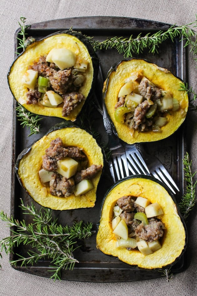 Sausage, apple and rosemary stuffed acorn squash. Only 10 ingredients! Gluten Free + Paleo + Dairy Free Option
