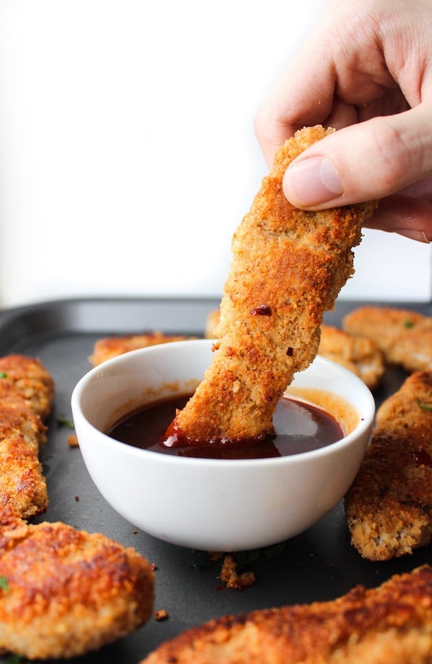 Paleo Chicken Tenders crusted in a almond flour blend and mixed with Chinese five spice with a sweet & spicy Asian dipping sauce | Gluten Free + Dairy Free + Low FODMAP option