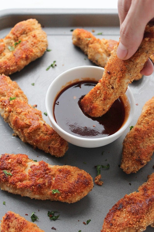 Paleo Chicken Tenders crusted in a almond flour blend and mixed with Chinese five spice with a sweet & spicy Asian dipping sauce | Gluten Free + Dairy Free + Low FODMAP option