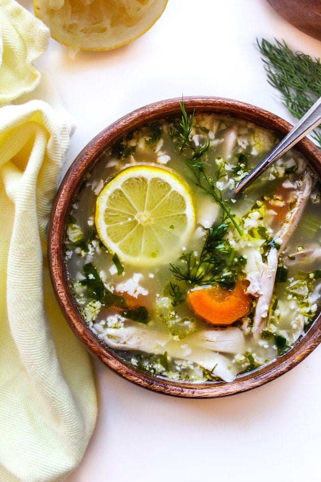 Lemon Chicken Soup with Cauliflower Rice in a bowl with a spoon