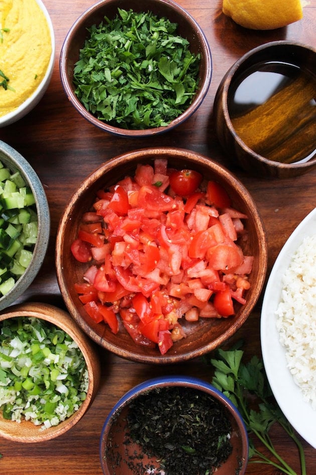 Cauliflower Tabbouleh - a Middle Eastern classic made gluten free | Fresh vegetables & herbs chopped, mixed and dressed in fresh lemon juice | Vegan + Paleo + Whole 30