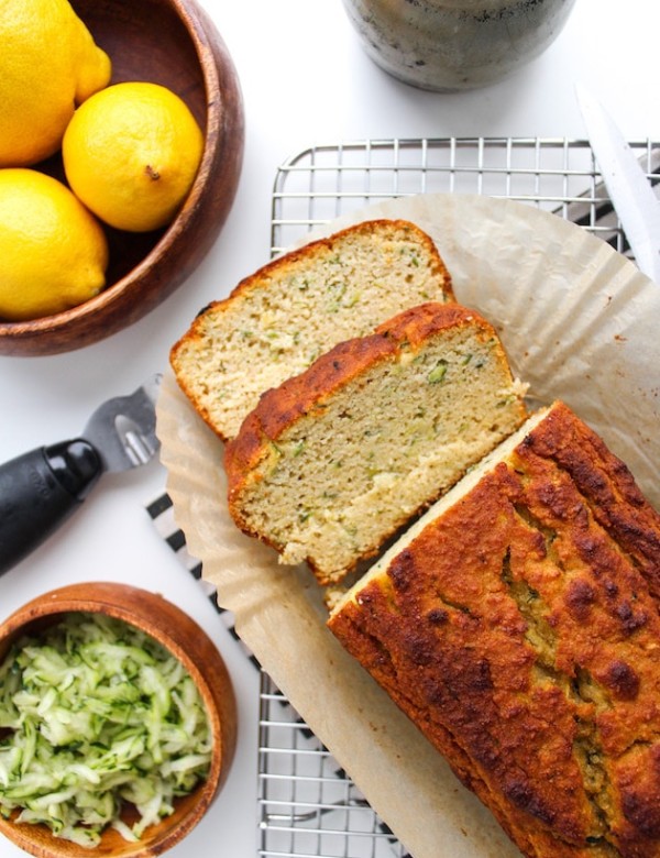 Paleo Lemon and Olive Oil Bread with a couple of slices on a cooling rack