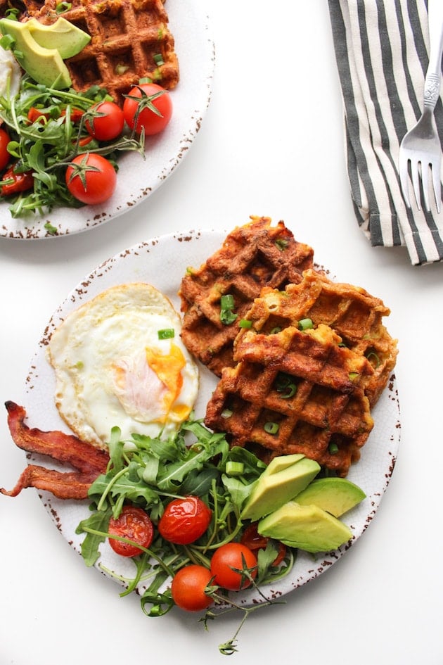 Paleo Sweet Potato Waffles on a plate with eggs and bacon