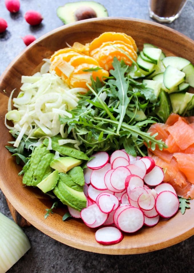 Arugula Fennel & Smoked Salmon Salad with radish, cucumber, oranges, and avocado topped in a simple orange vinaigrette | Paleo + Gluten Free