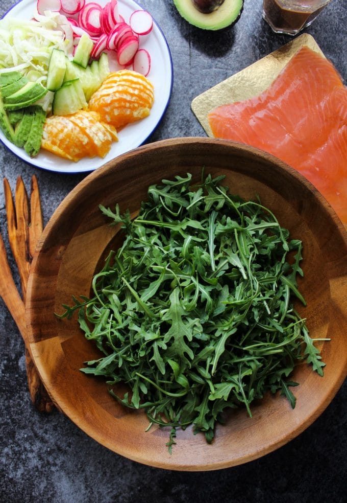 Arugula Fennel & Smoked Salmon Salad with radish, cucumber, oranges, and avocado topped in a simple orange vinaigrette | Paleo + Gluten Free