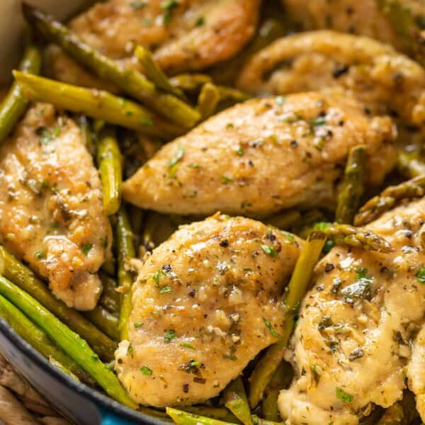 Lemon Chicken with Asparagus in a pan with fresh parsley