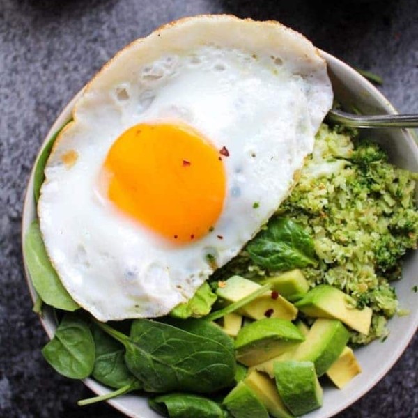 Pesto Cauliflower Rice Bowls topped with an egg and avocado