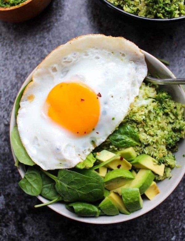 Pesto Cauliflower Rice Bowls topped with an egg and avocado