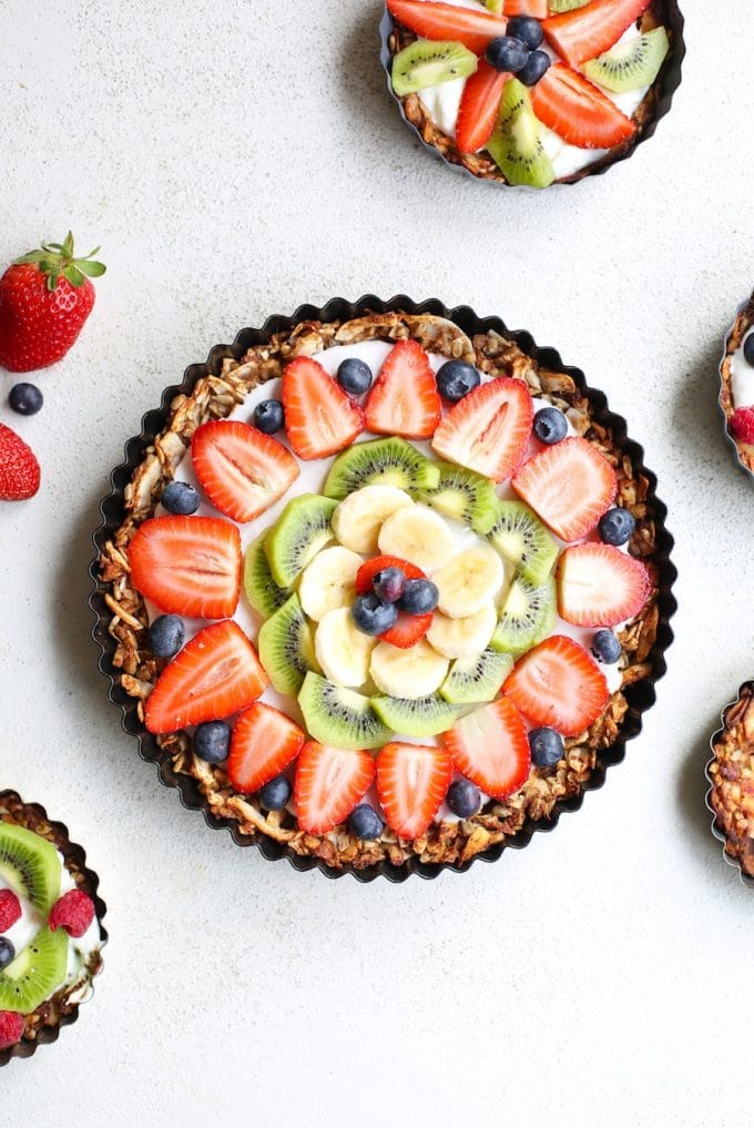 Fruity Granola Breakfast Pizza - a grain free nut & coconut crust that's naturally sweetened with a coconut cream top and fresh fruit | Paleo + Vegan + Gluten Free