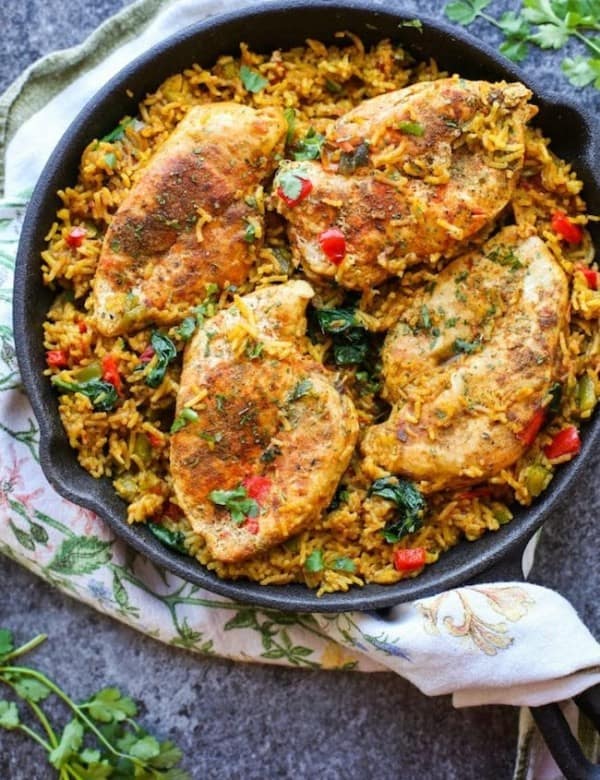 One Pot Low FODMAP Chicken and Rice (Khichdi Inspired) in a cast iron pan