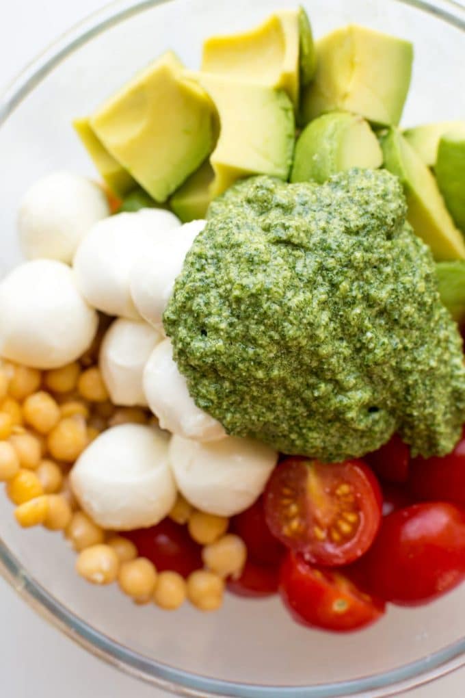 Avocado Chickpea Pesto Salad ingredients in a bowl