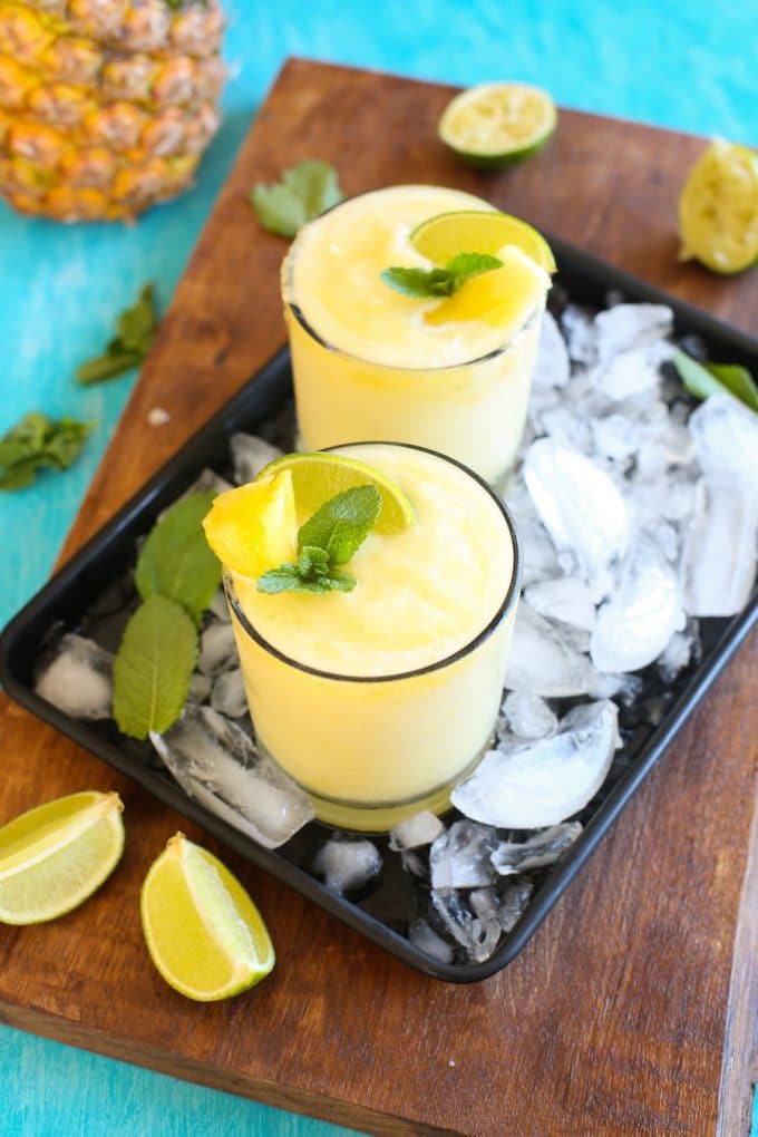 Pineapple, freshly squeezed lime juice, tequila and triple sec are combined in these light, naturally sweetened & refreshing Frozen Pineapple Margaritas!