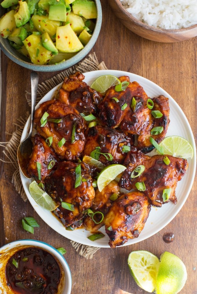 Garlicky Honey Sriracha Chicken - sticky, spicy chicken balanced out with a sweet pineapple avocado salsa | Gluten Free + Paleo