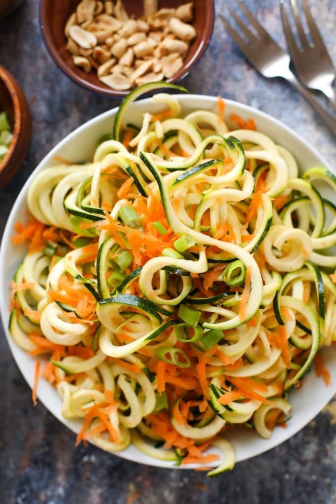 15 minute Raw Peanut Zoodle Salad with spiralized zucchini, shredded carrots and a simple peanut dressing. | Gluten Free + Vegan + Paleo Option 