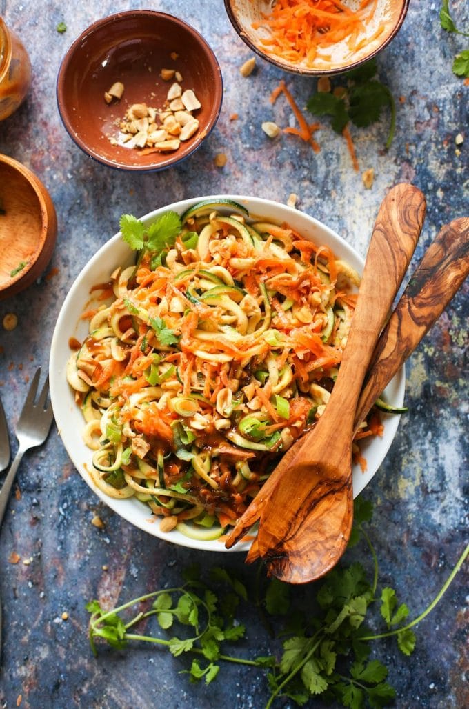 15 minute Raw Peanut Zoodle Salad with spiralized zucchini, shredded carrots and a simple peanut dressing. | Gluten Free + Vegan + Paleo Option 